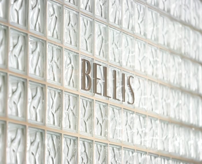 Bellis logo on a glass block wall at Bellis Clinic in Seongsu, Seoul
